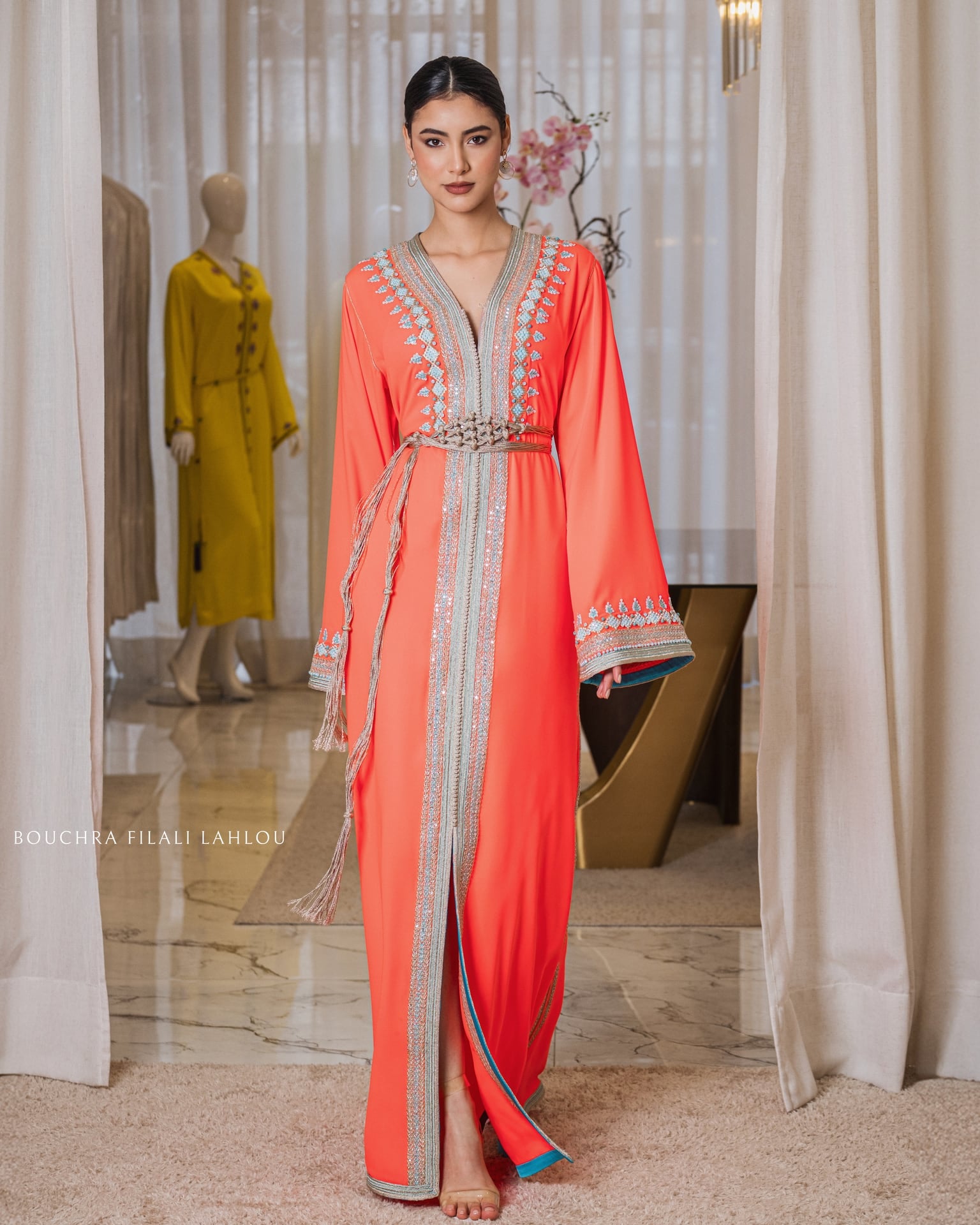 Persimmon dress with a silver braid from collar to hem and a matching woven belt