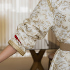 Ivory Dawn kaftan puffed sleeve detail with gold embroidery on ivory fabric