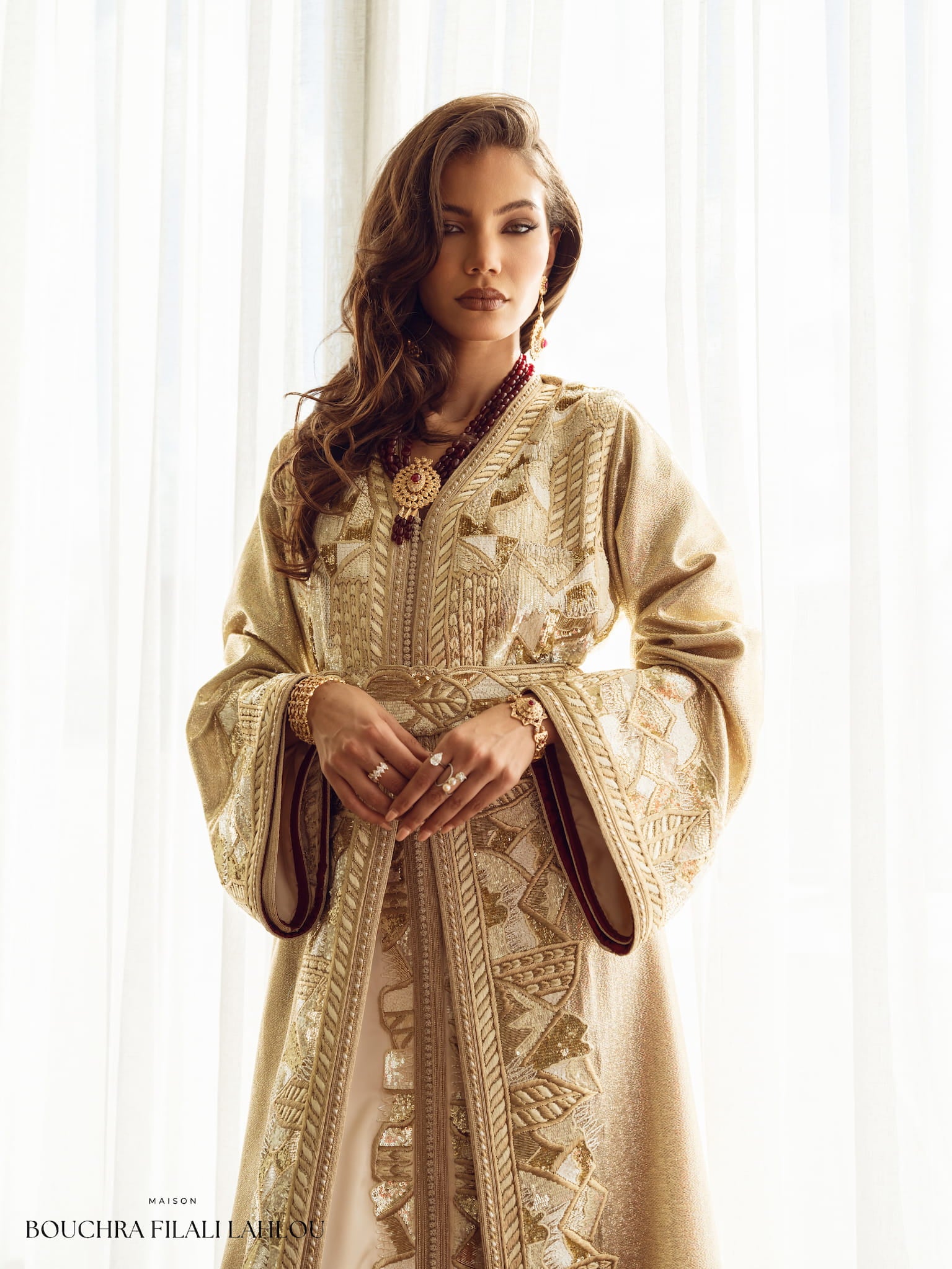 Soft gold couture Moroccan kaftan with embroidered belt and wide sleeves, front view